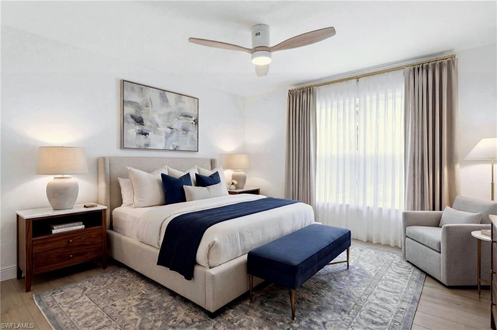 21314 Braxfield Loop Estero, FL 33928 - Photo 28 of 44 a spacious bedroom with a bed and a couch