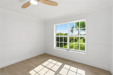 a view of a house with a backyard porch and sitting area