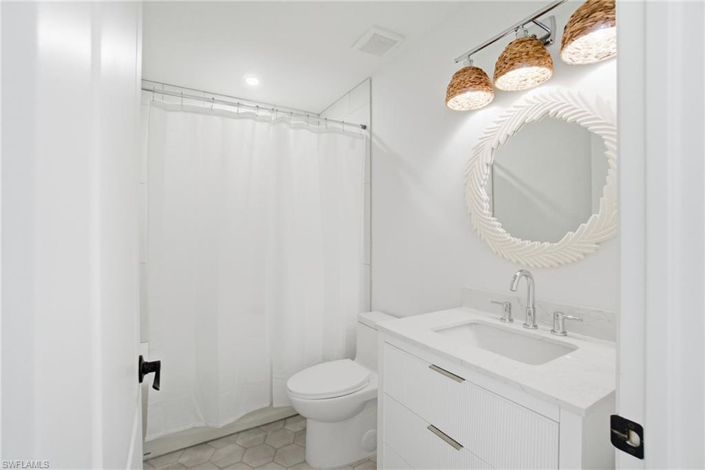 21314 Braxfield Loop Estero, FL 33928 - Photo 31 of 44 a bathroom with a sink toilet and a mirror