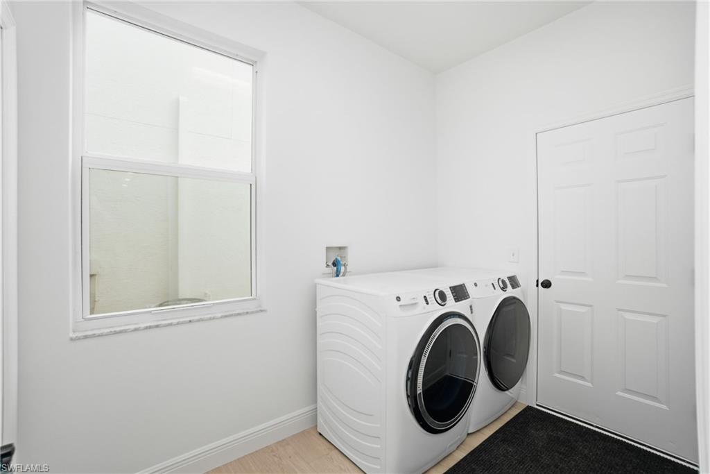 21314 Braxfield Loop Estero, FL 33928 - Photo 35 of 44 a utility room with dryer and washer
