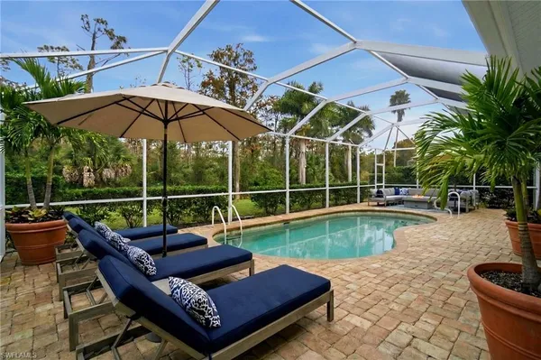 a view of a swimming pool with a porch