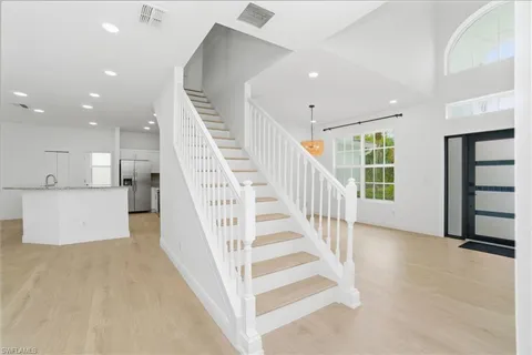 en view interior of a house with wooden floor and windows