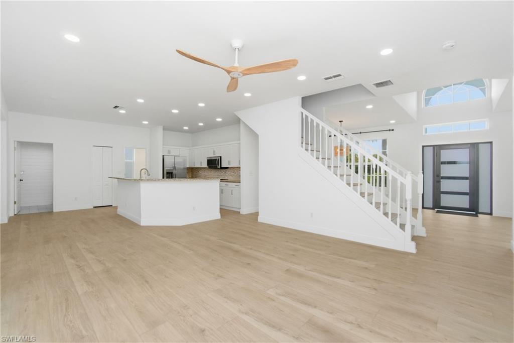 21314 Braxfield Loop Estero, FL 33928 - Photo 10 of 44 a view of a kitchen with a sink and a refrigerator
