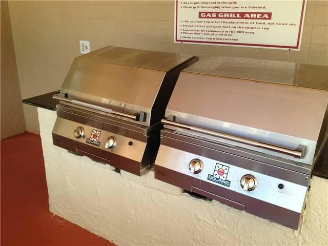 a view of a house with a yard and a pond