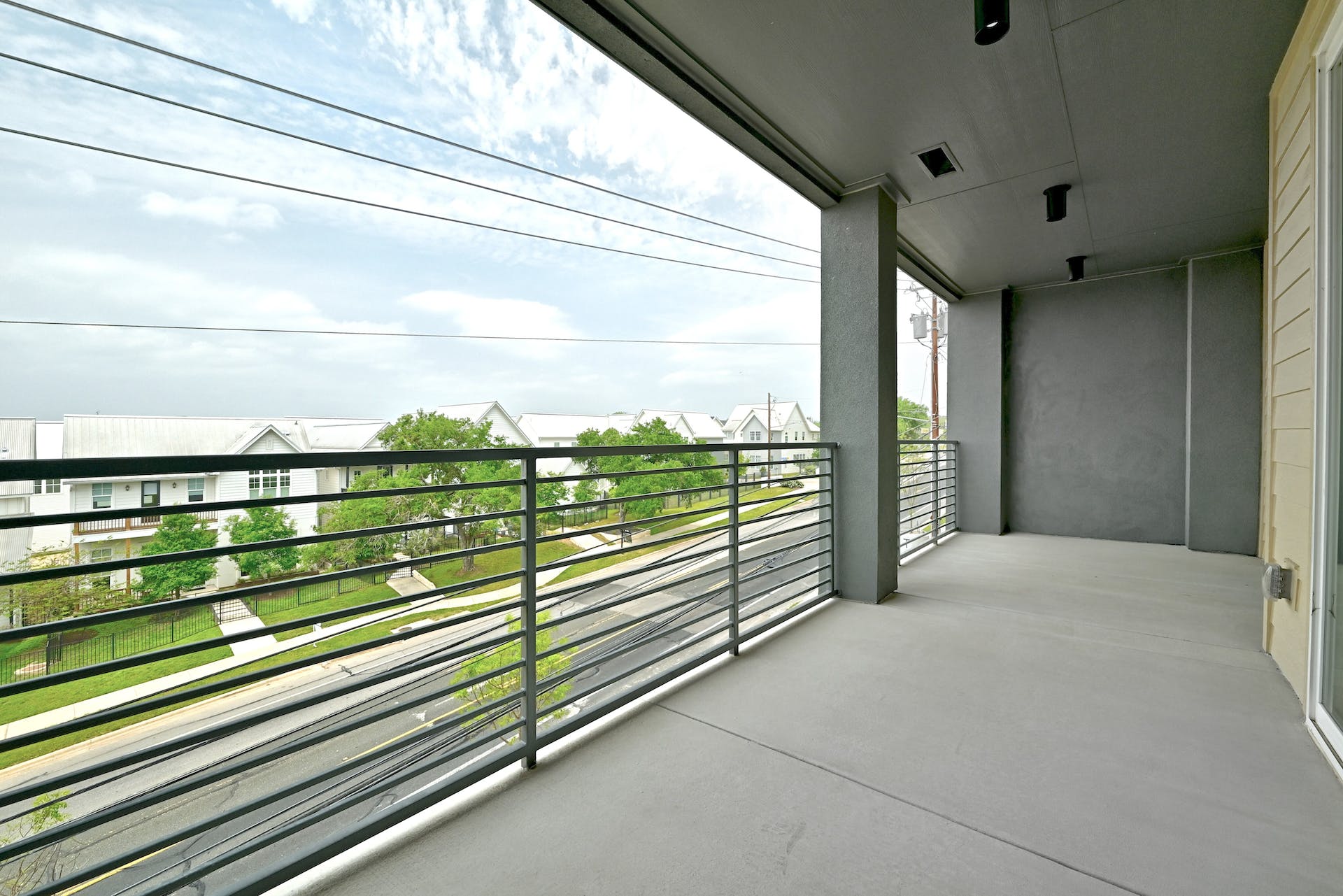 4801 Springdale Road, Unit 1301 Austin, TX 78723 - Photo 25 of 39 Unwind outdoors on this ample private balcony, overlooking the serene neighborhood.