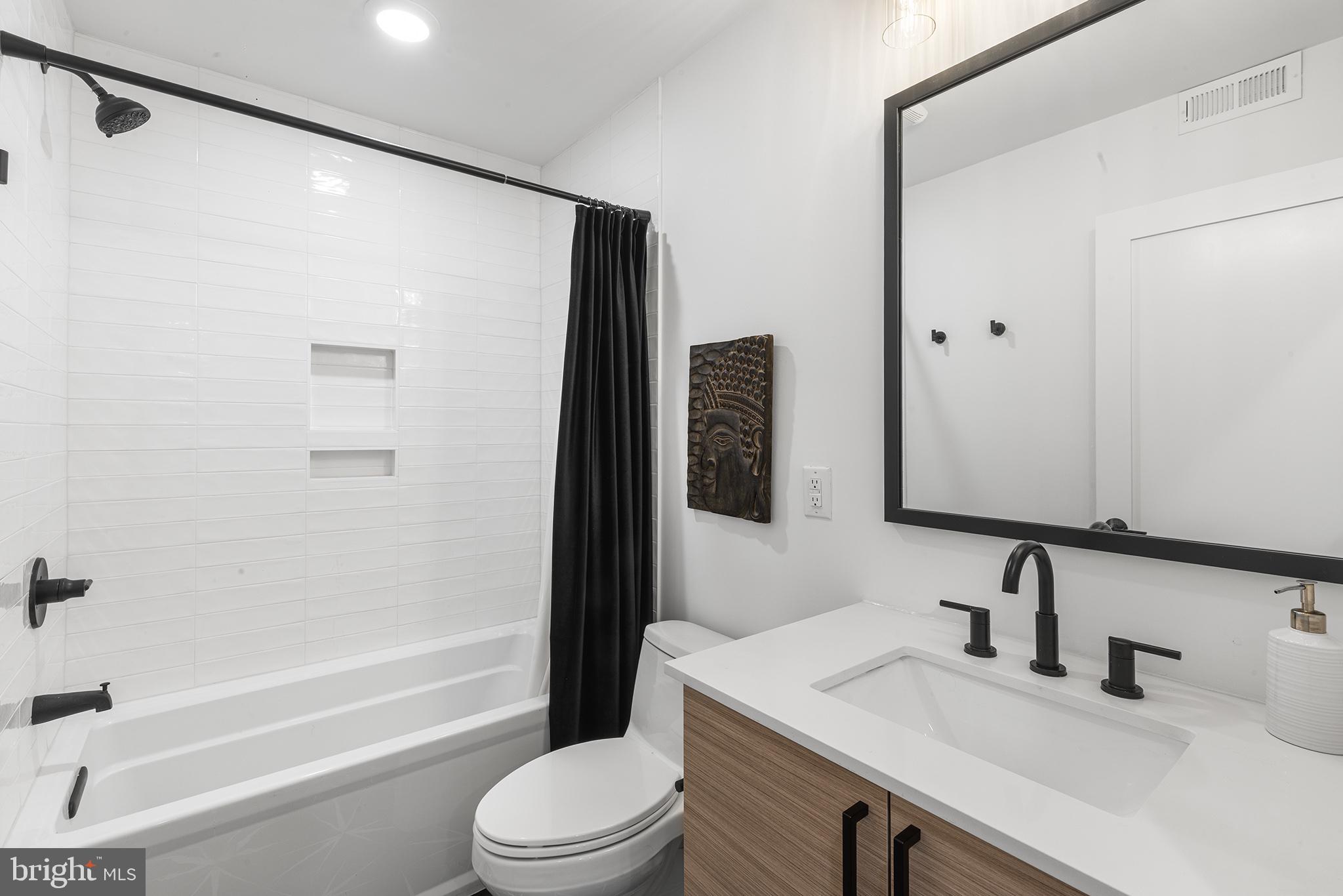 1507 Christian Street, Unit 4 Philadelphia, PA 19146 - Photo 20 of 26 a bathroom with a sink a toilet and shower