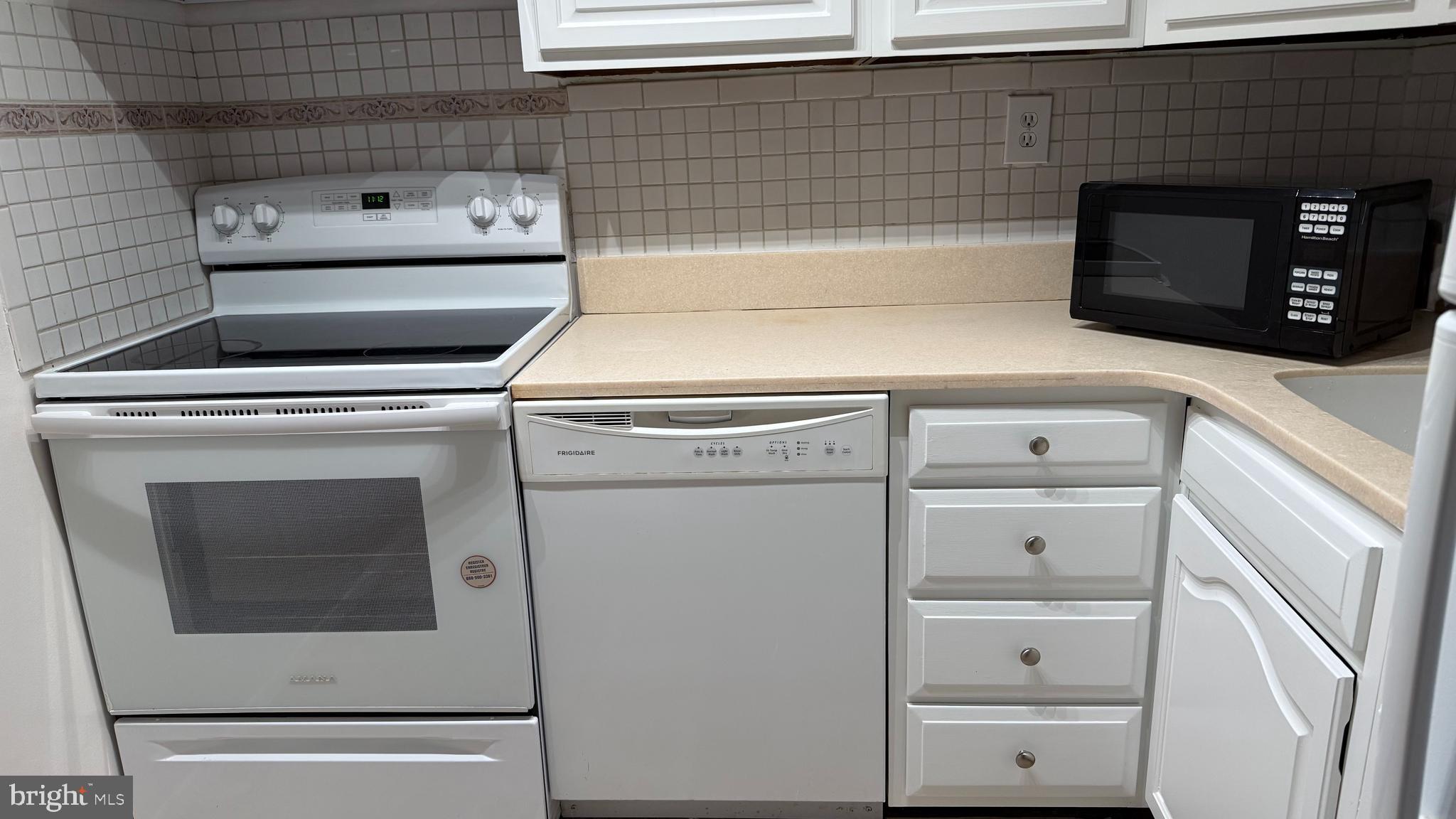 2120 N Street Northwest, Unit 101 Washington, DC 20037 - Photo 15 of 21 a close up view of washer and dryer