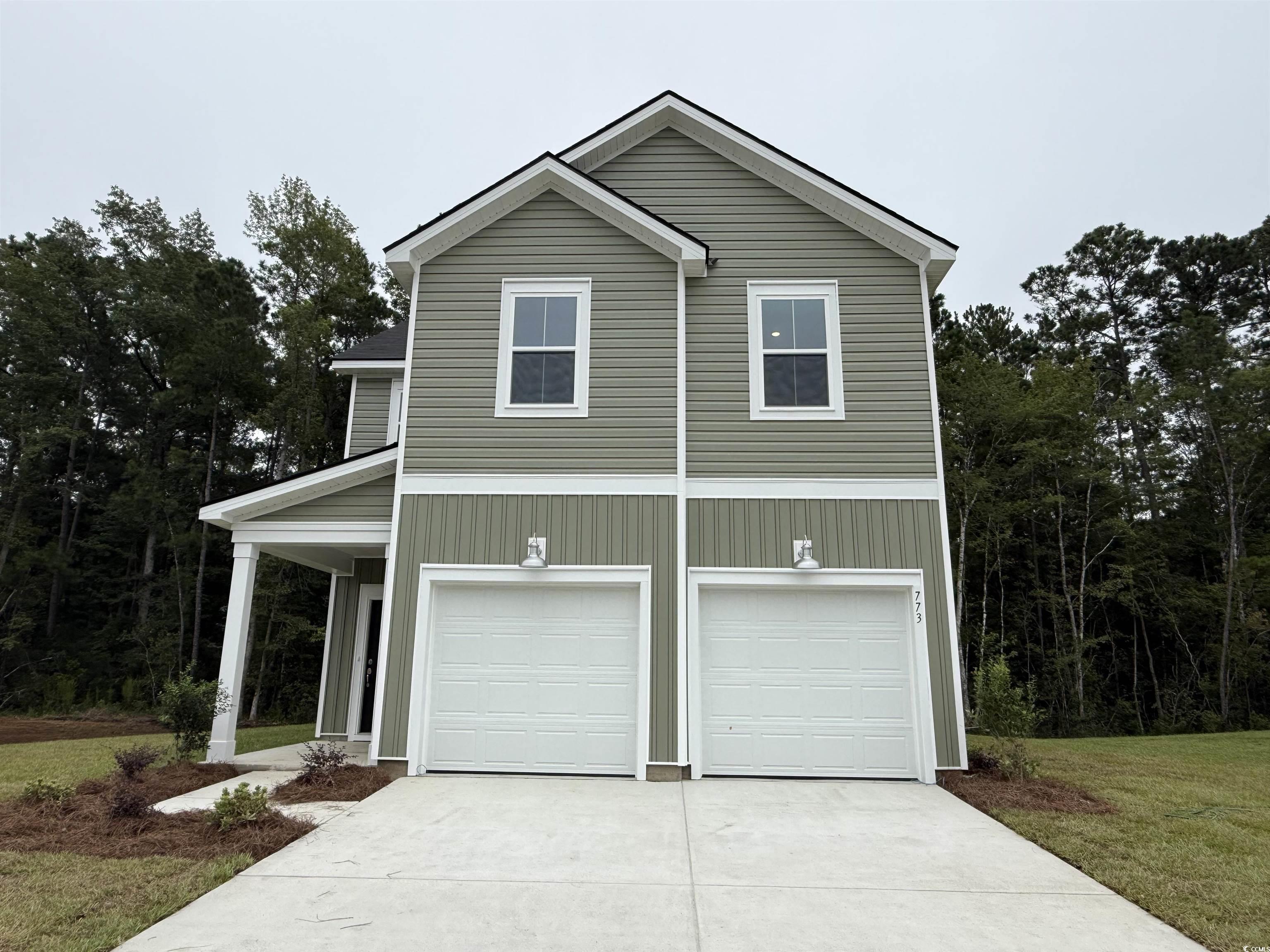 773 Sturdy Root Place Myrtle Beach, SC 29588 - Photo 1 of 19 View of front of house featuring driveway, an atta