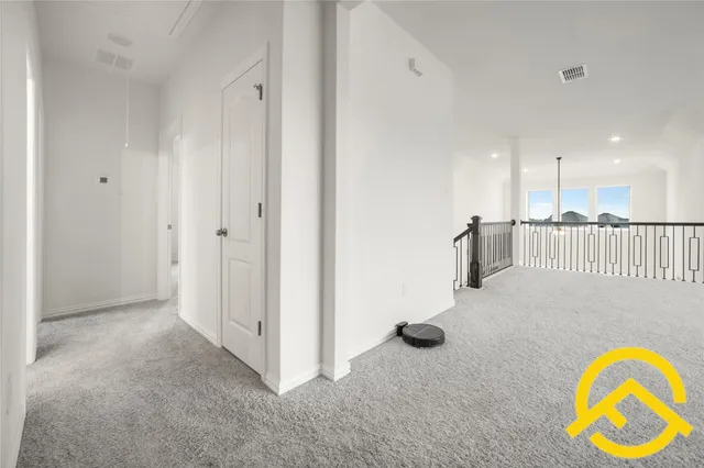 a view of a livingroom with furniture and staircase