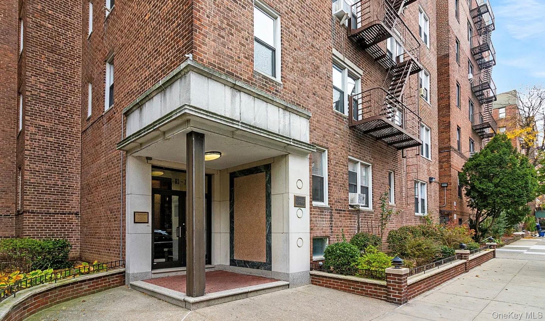 65-70 Booth Street, Unit 6F Queens, NY 11374 - Photo 1 of 11 a front view of a house