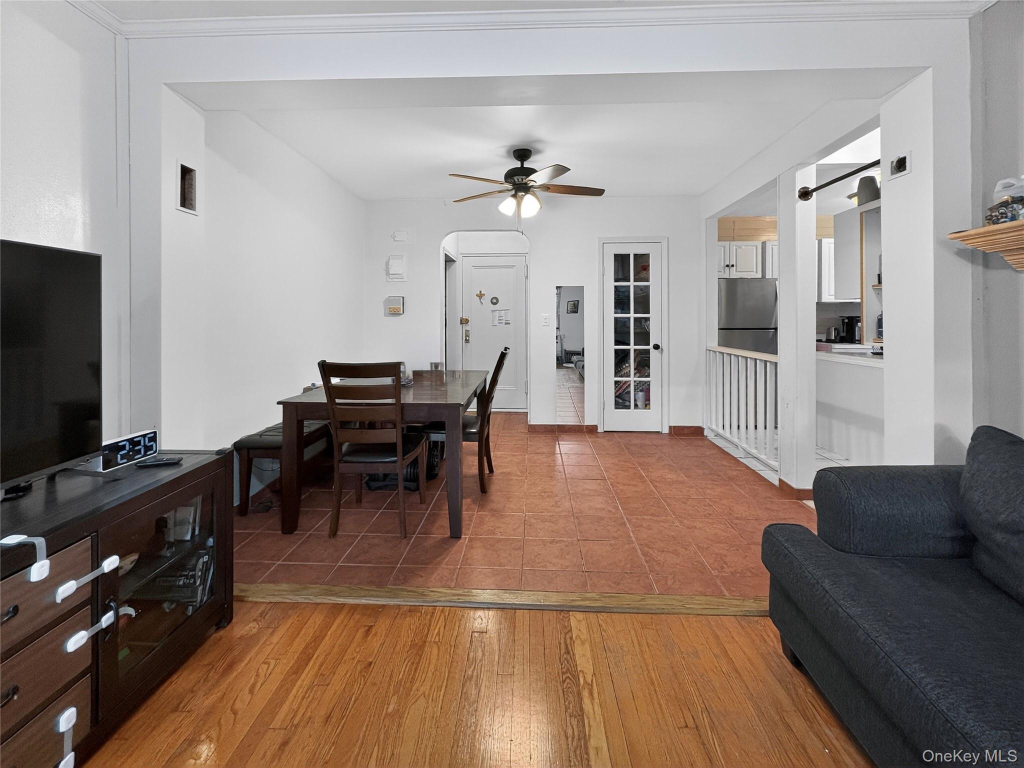 65-70 Booth Street, Unit 6F Queens, NY 11374 - Photo 4 of 11 a living room with furniture and a flat screen tv