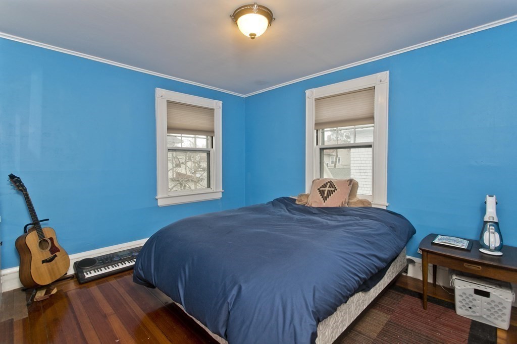 44 Fairfield Street Springfield, MA 01108 - Photo 26 of 41 a bedroom with a bed and wooden floor