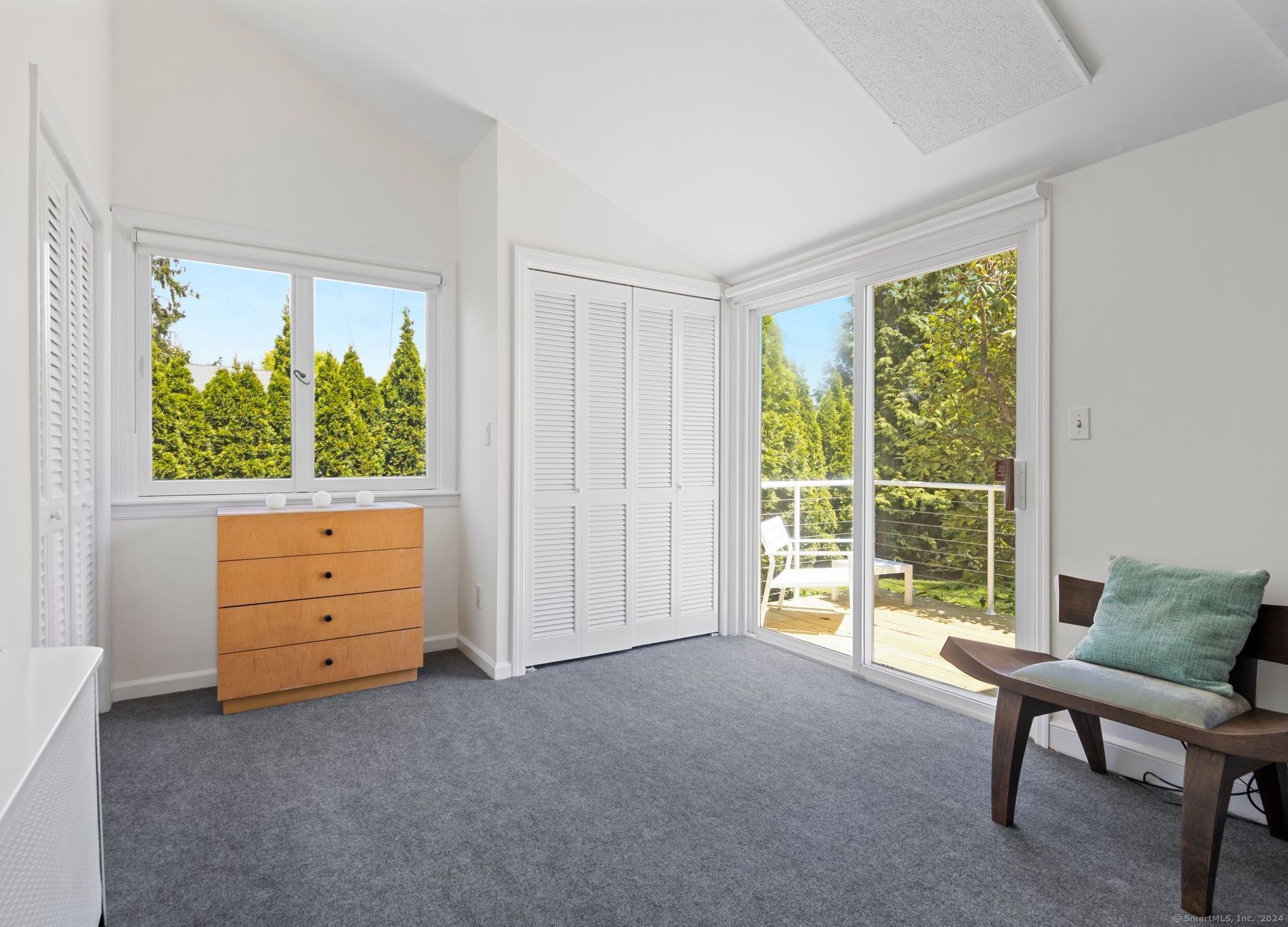 232 Hillspoint Road Westport, CT 06880 - Photo 14 of 39 a room with chair and large window