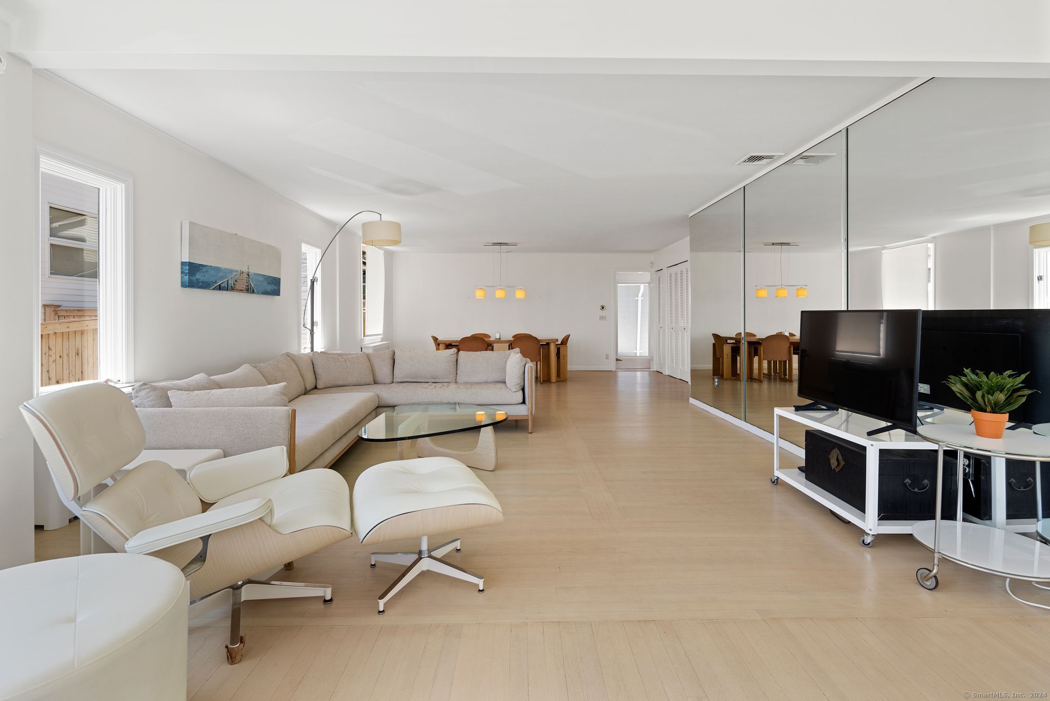 232 Hillspoint Road Westport, CT 06880 - Photo 15 of 39 a living room with furniture and a flat screen tv