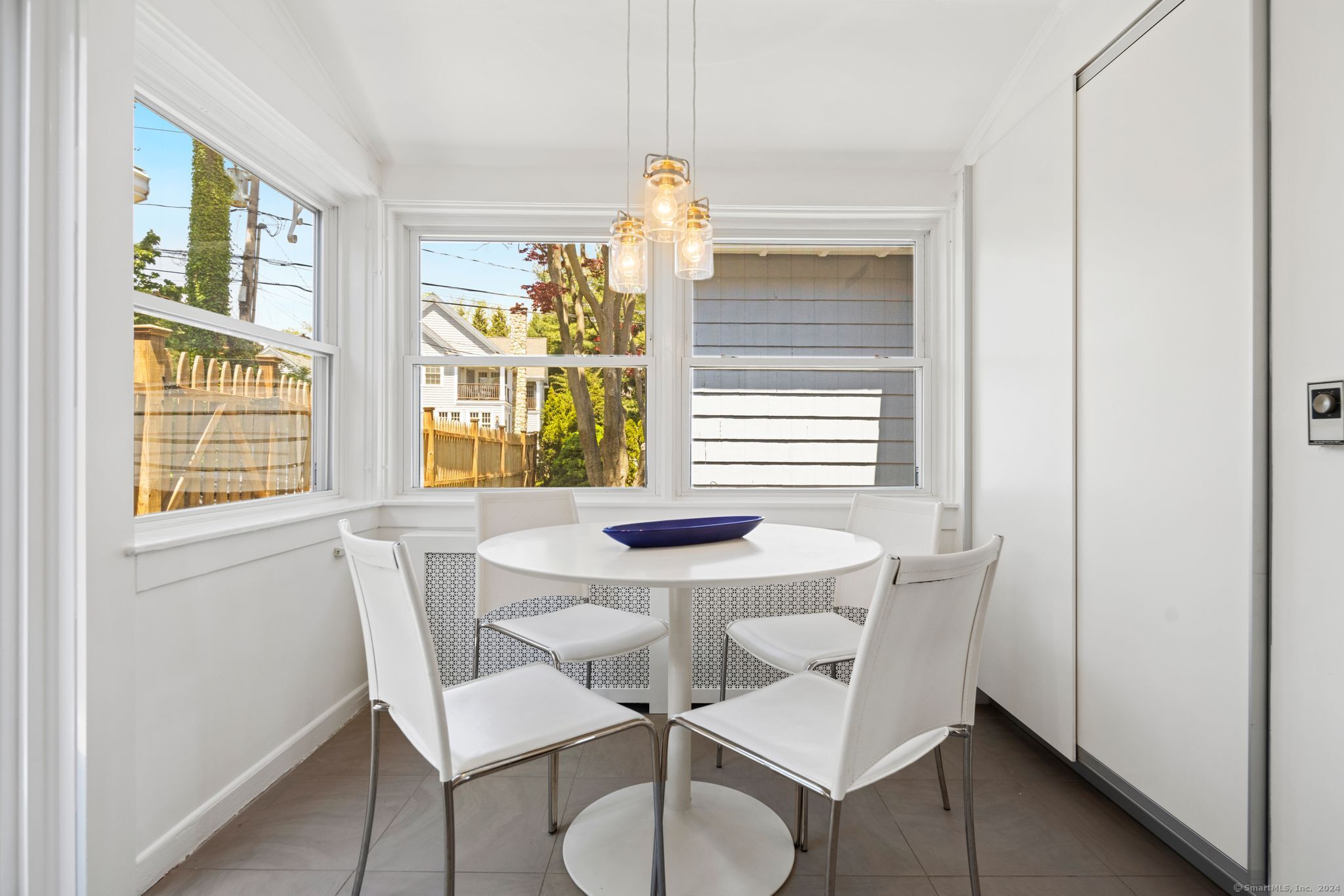 232 Hillspoint Road Westport, CT 06880 - Photo 24 of 39 a view of a dining room with furniture window and outside view