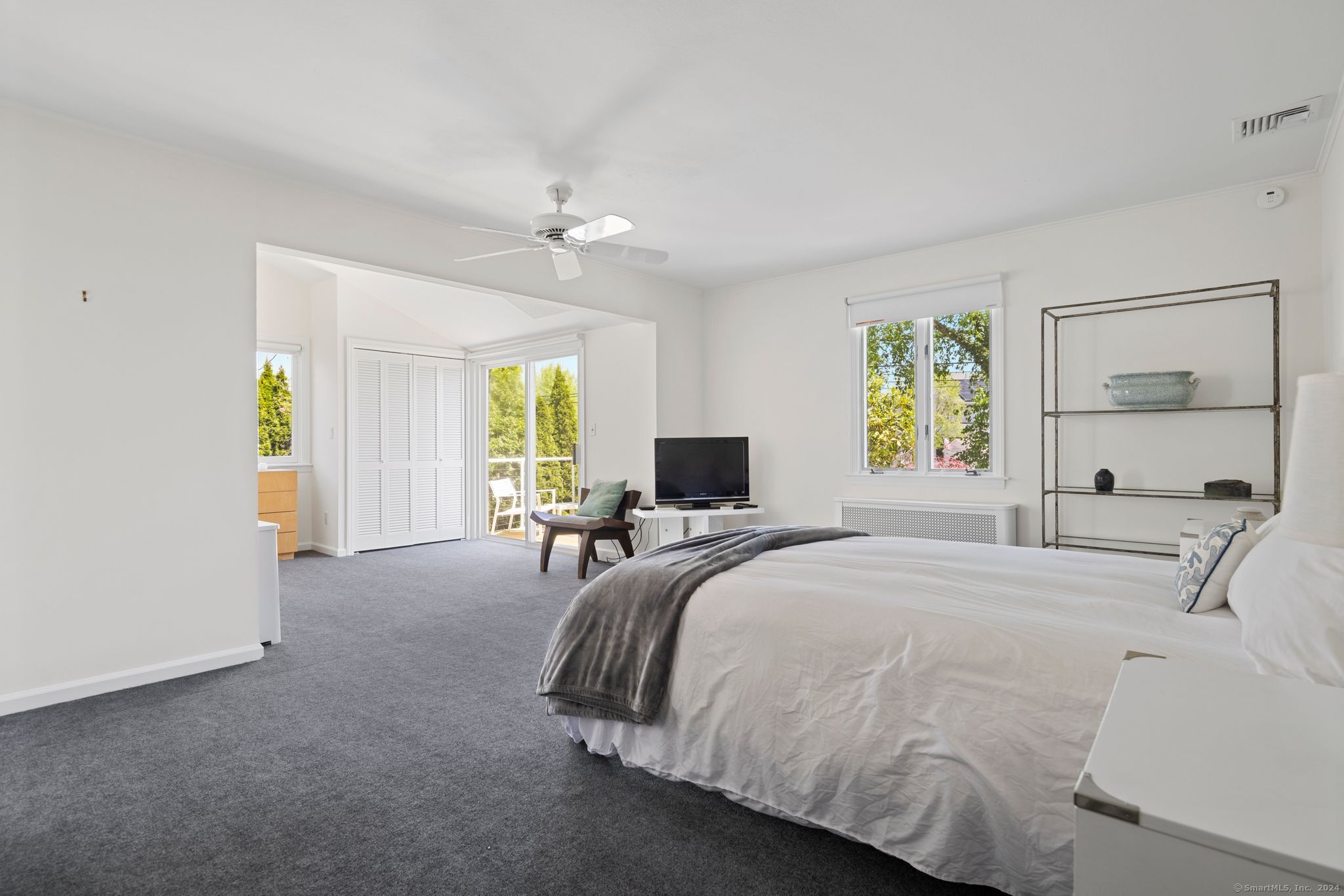 232 Hillspoint Road Westport, CT 06880 - Photo 27 of 39 a bedroom with a bed and window