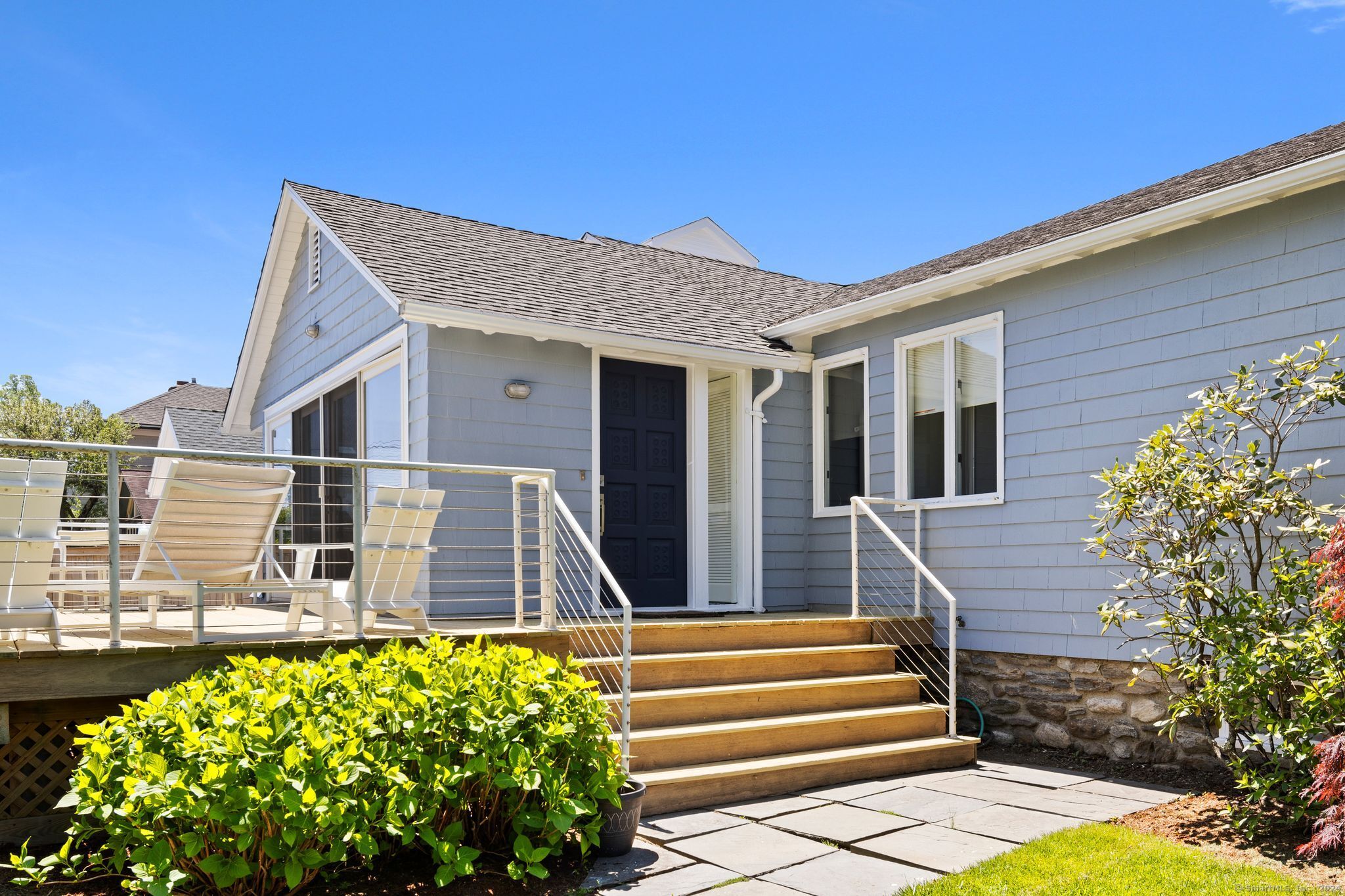 232 Hillspoint Road Westport, CT 06880 - Photo 3 of 39 a front view of a house with garden