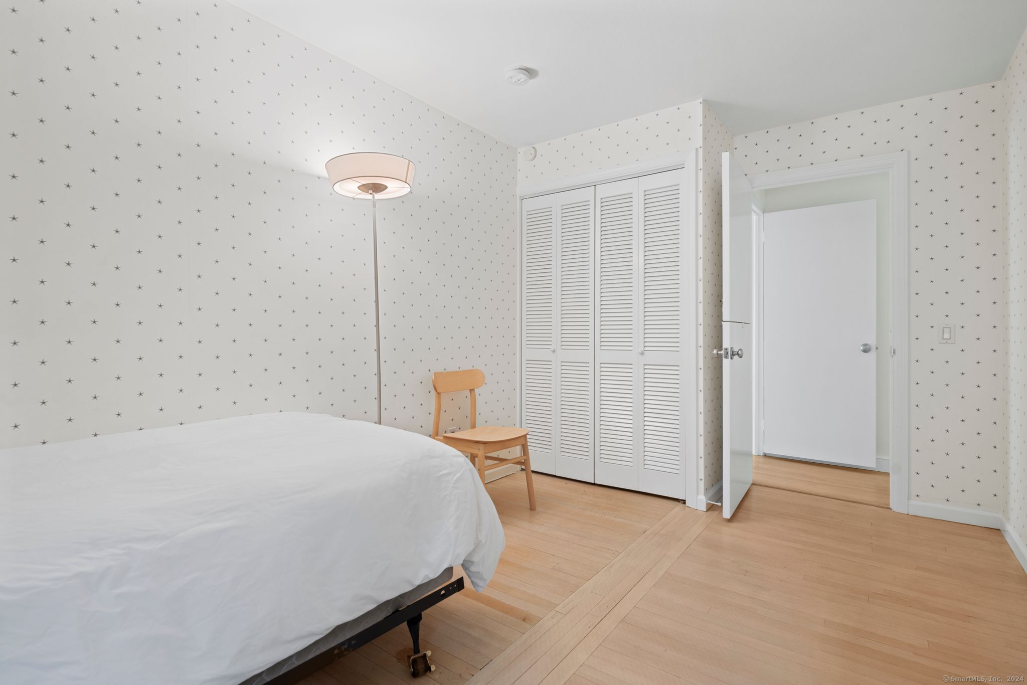 232 Hillspoint Road Westport, CT 06880 - Photo 32 of 39 a bedroom with a bed and a refrigerator