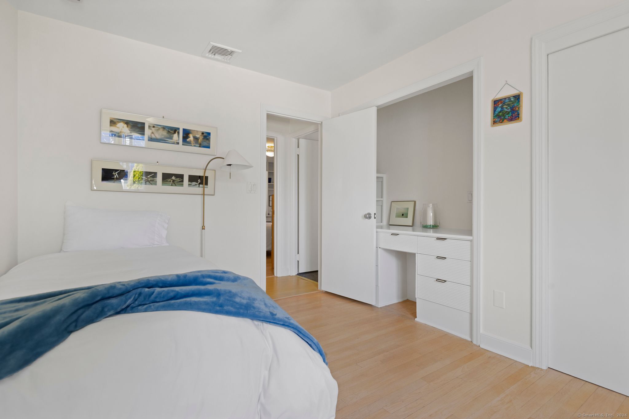 232 Hillspoint Road Westport, CT 06880 - Photo 34 of 39 a spacious bedroom with a bed and a view of bathroom