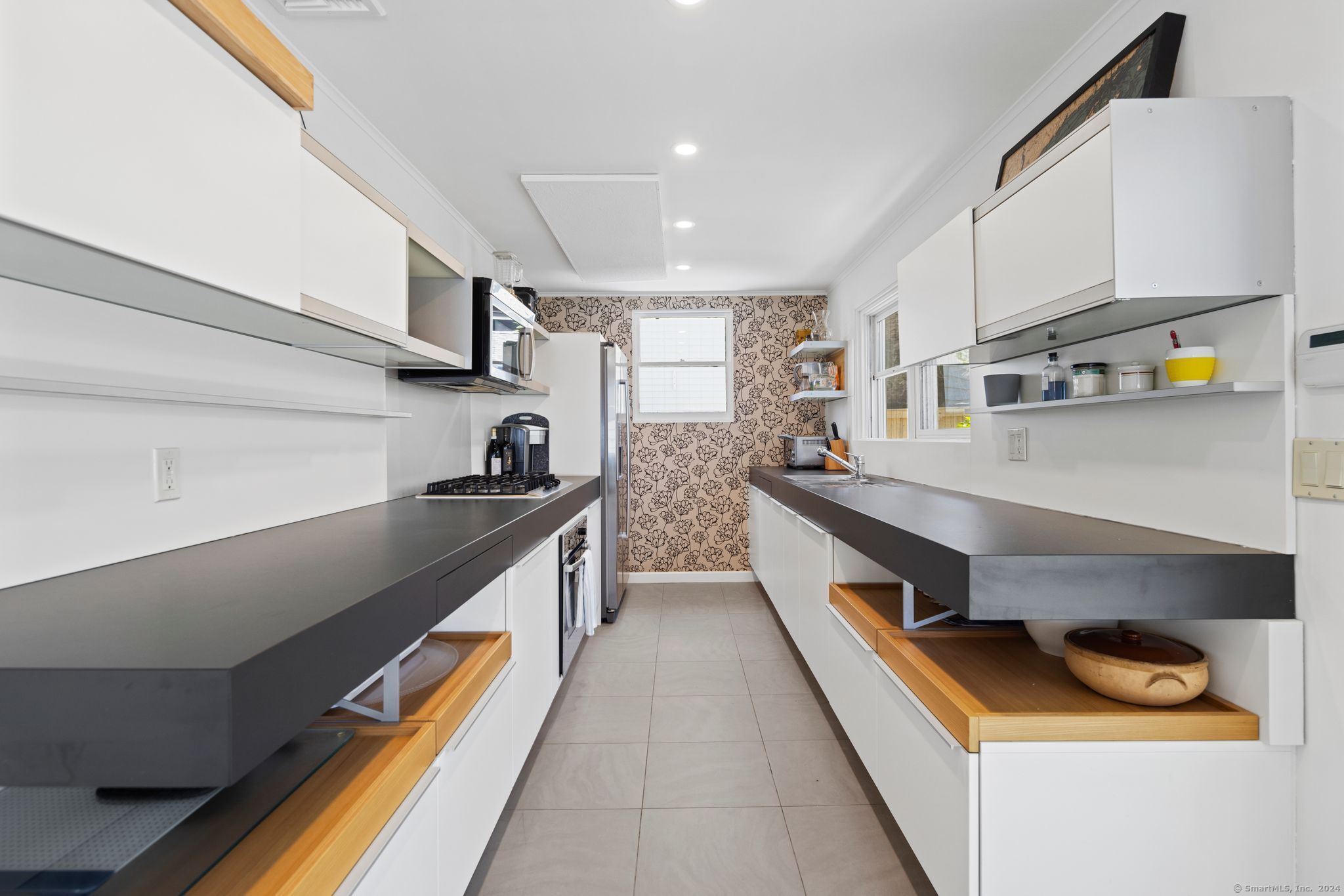 232 Hillspoint Road Westport, CT 06880 - Photo 9 of 39 a kitchen with stainless steel appliances granite countertop lots of counter top space and cabinets