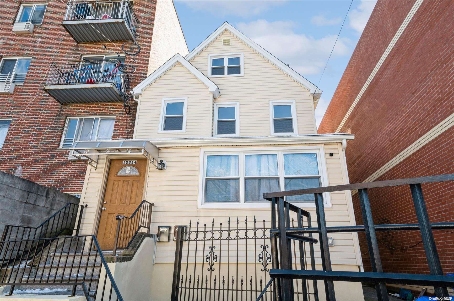 108-14 37th Avenue Queens, NY 11368 - Photo 1 of 22 a view of a brick house with large windows