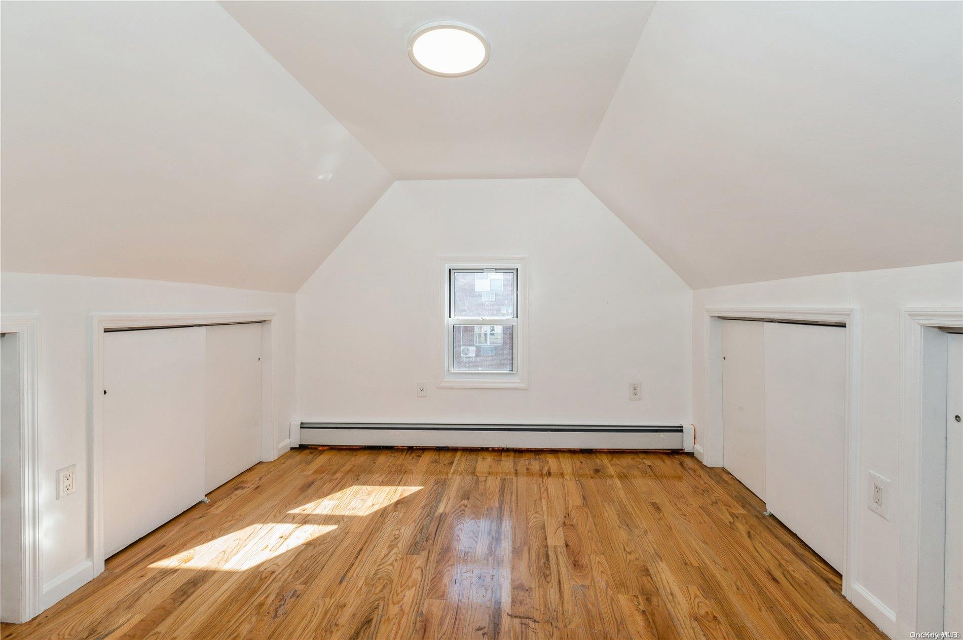 108-14 37th Avenue Queens, NY 11368 - Photo 8 of 22 a view of empty room with wooden floor