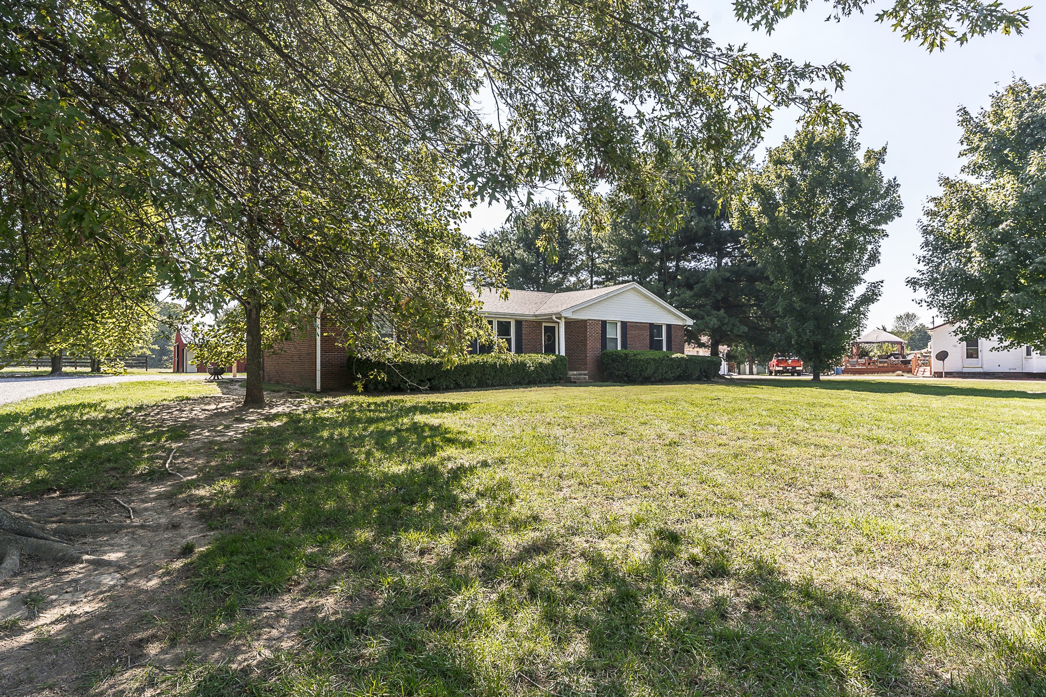 4451 Roy Cole Road Springfield, TN 37172 - Photo 4 of 43 a house view with swimming pool and trees in the background