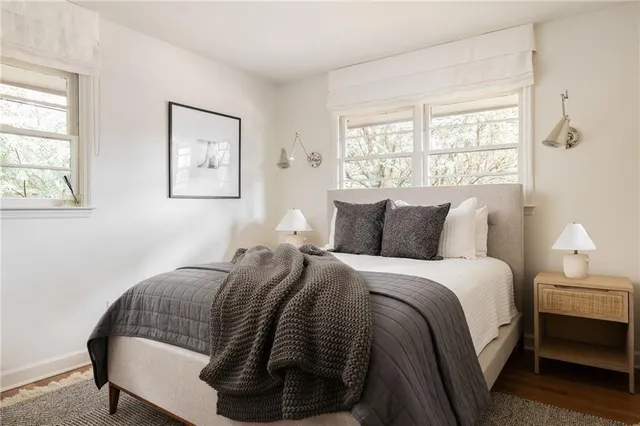 a bedroom with bed and window