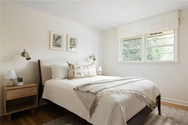 a bedroom with bed and a window