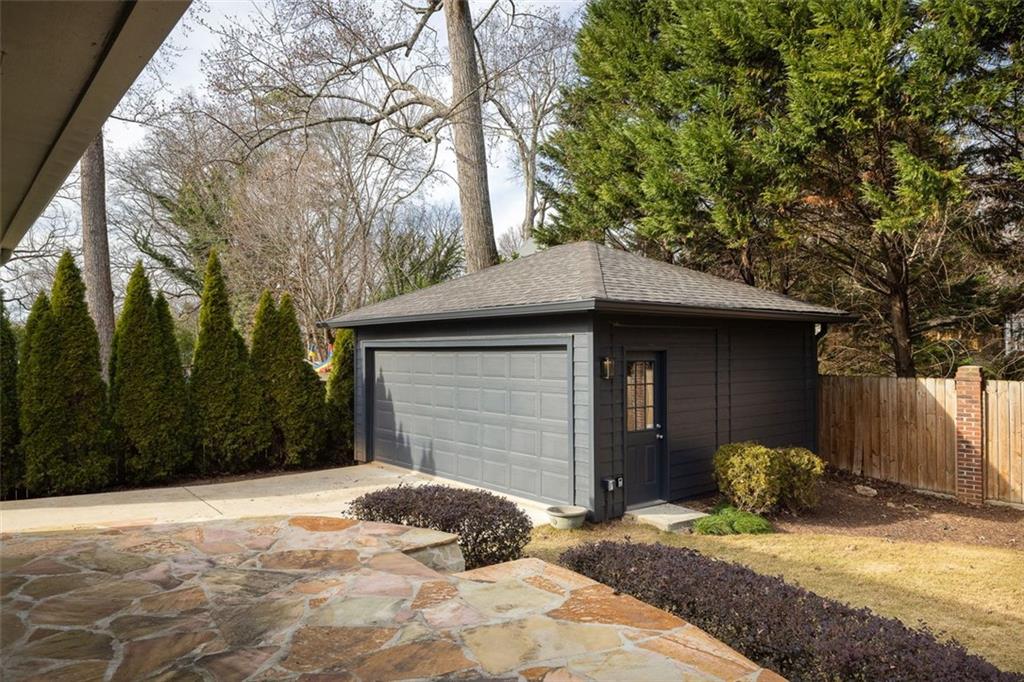 902 Cumberland Road Northeast Atlanta, GA 30306 - Photo 20 of 22 a backyard of a house with yard and tree