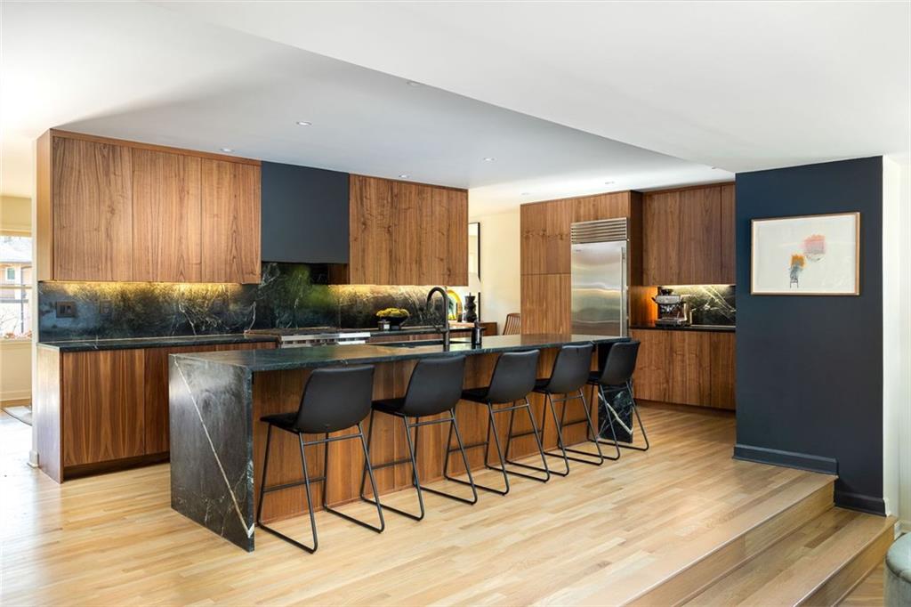 902 Cumberland Road Northeast Atlanta, GA 30306 - Photo 4 of 22 a kitchen with stainless steel appliances granite countertop sink refrigerator and microwave