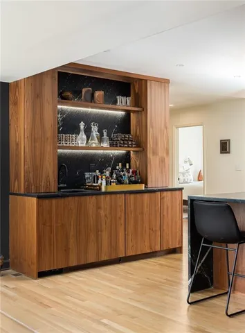 a living room with wooden floor and furniture