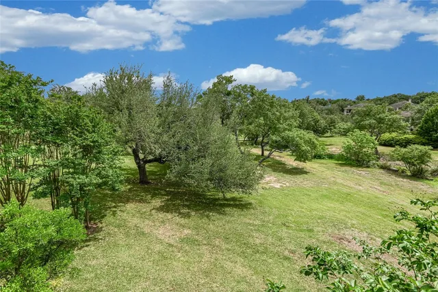 a view of a golf course with a lake view