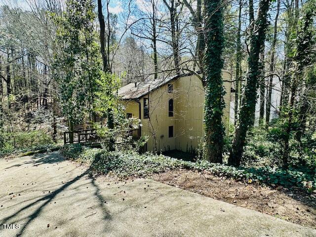 6208 Rushingbrook Drive Raleigh, NC 27612 - Photo 9 of 11 Looks like it could be a peaceful mountain retreat or ski chalet among all the woods.