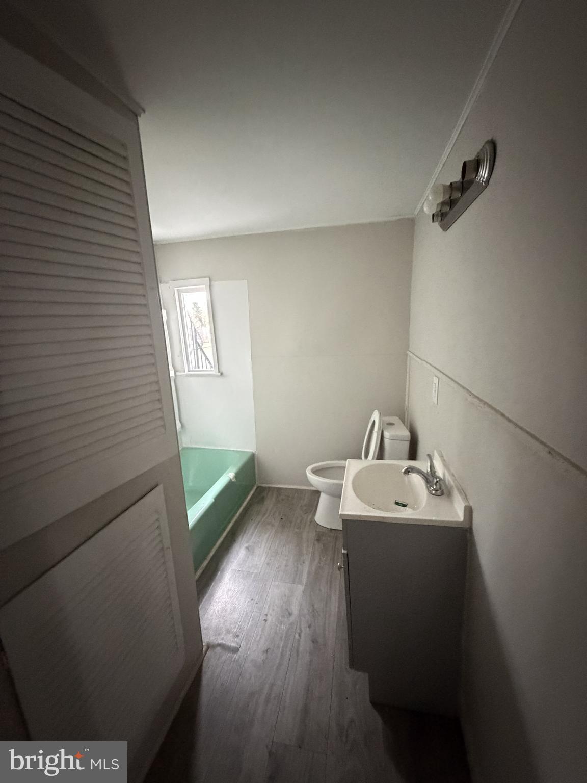 190 7th Street, Unit 1 Salem, NJ 08079 - Photo 9 of 16 a bathroom with a sink and mirror
