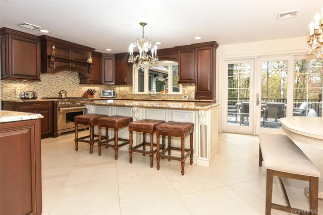 a view of a kitchen with granite countertop cabinets and outdoor view