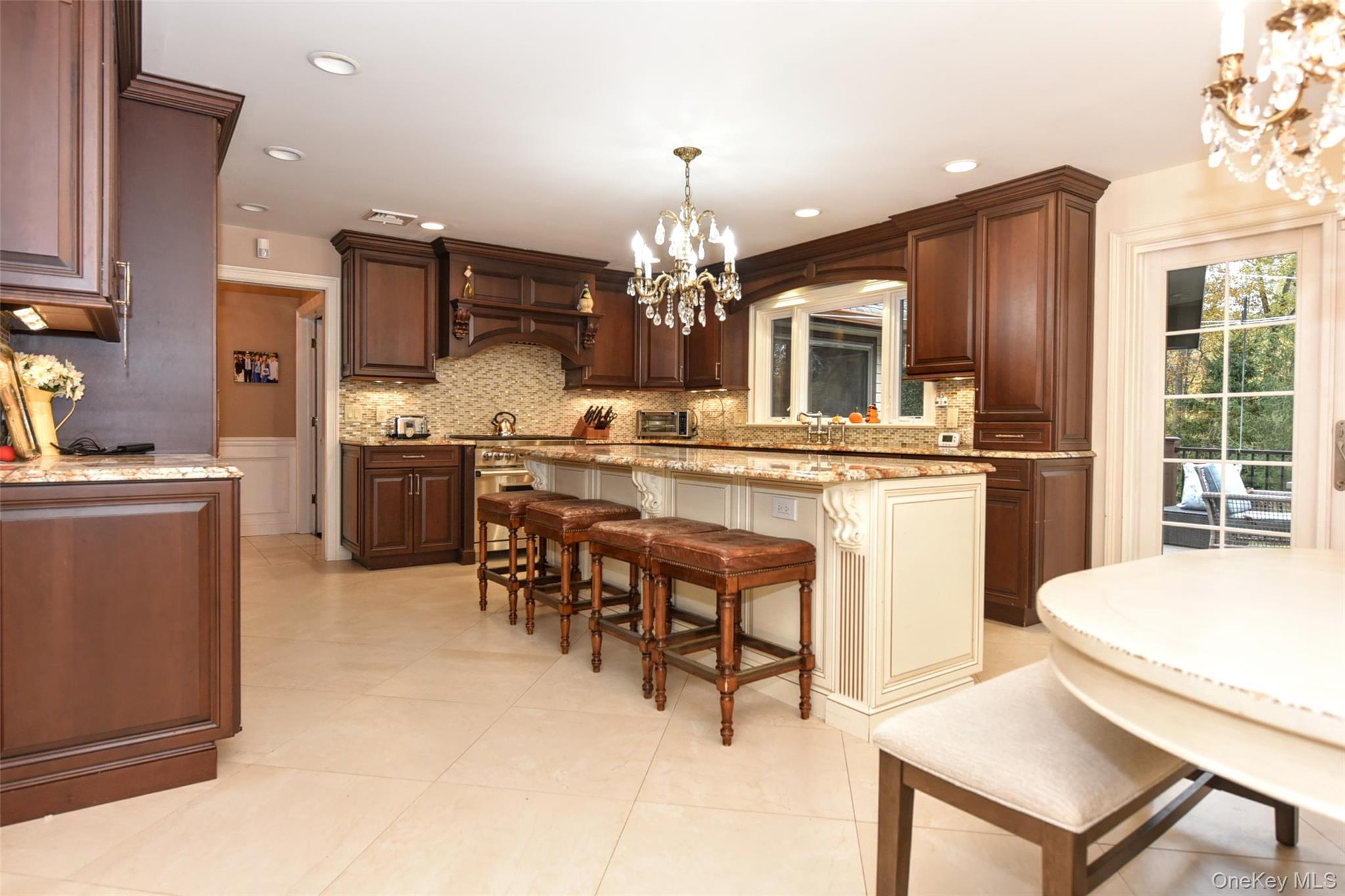 4 Abbey Road West Nyack, NY 10994 - Photo 13 of 50 a kitchen with kitchen island dining table and stainless steel appliances