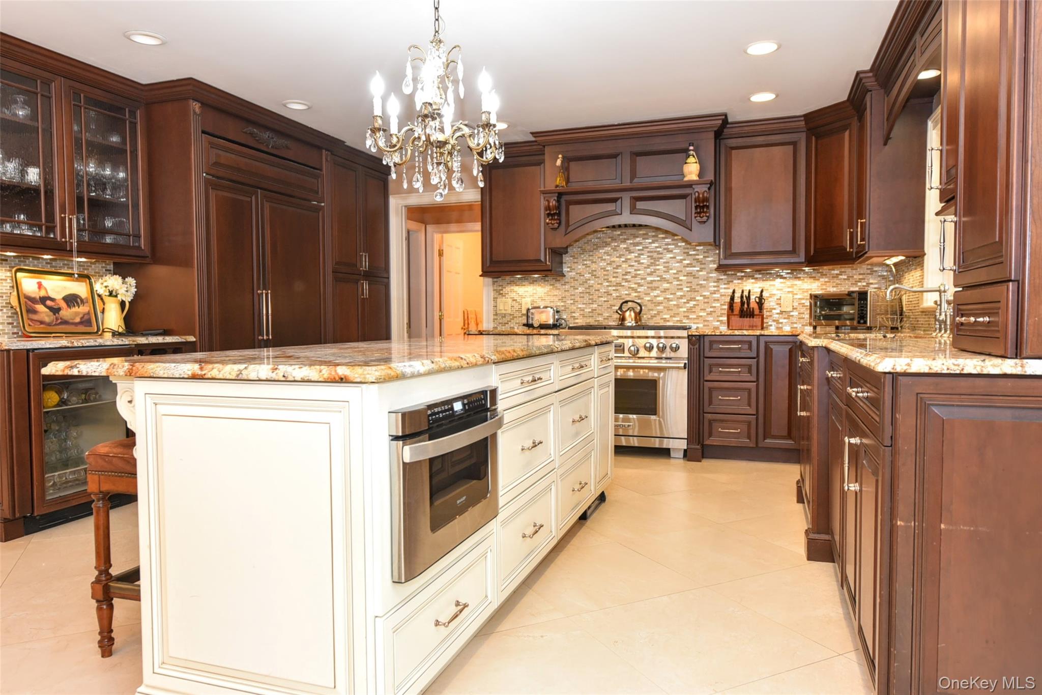 4 Abbey Road West Nyack, NY 10994 - Photo 15 of 50 a kitchen with stainless steel appliances granite countertop a stove top oven a sink dishwasher and white cabinets with wooden floor