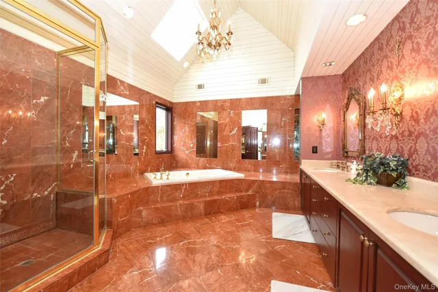 a bathroom with a tub and shower