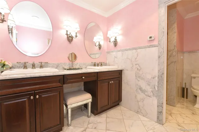 a bathroom with a sink vanity and a mirror