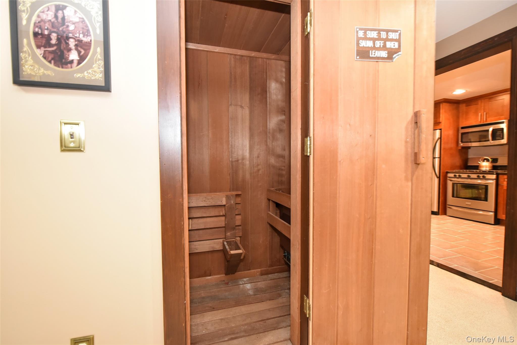 4 Abbey Road West Nyack, NY 10994 - Photo 33 of 50 a view of a hallway with wooden floor and a bathroom