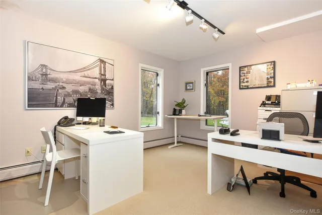 a workspace with furniture and a window