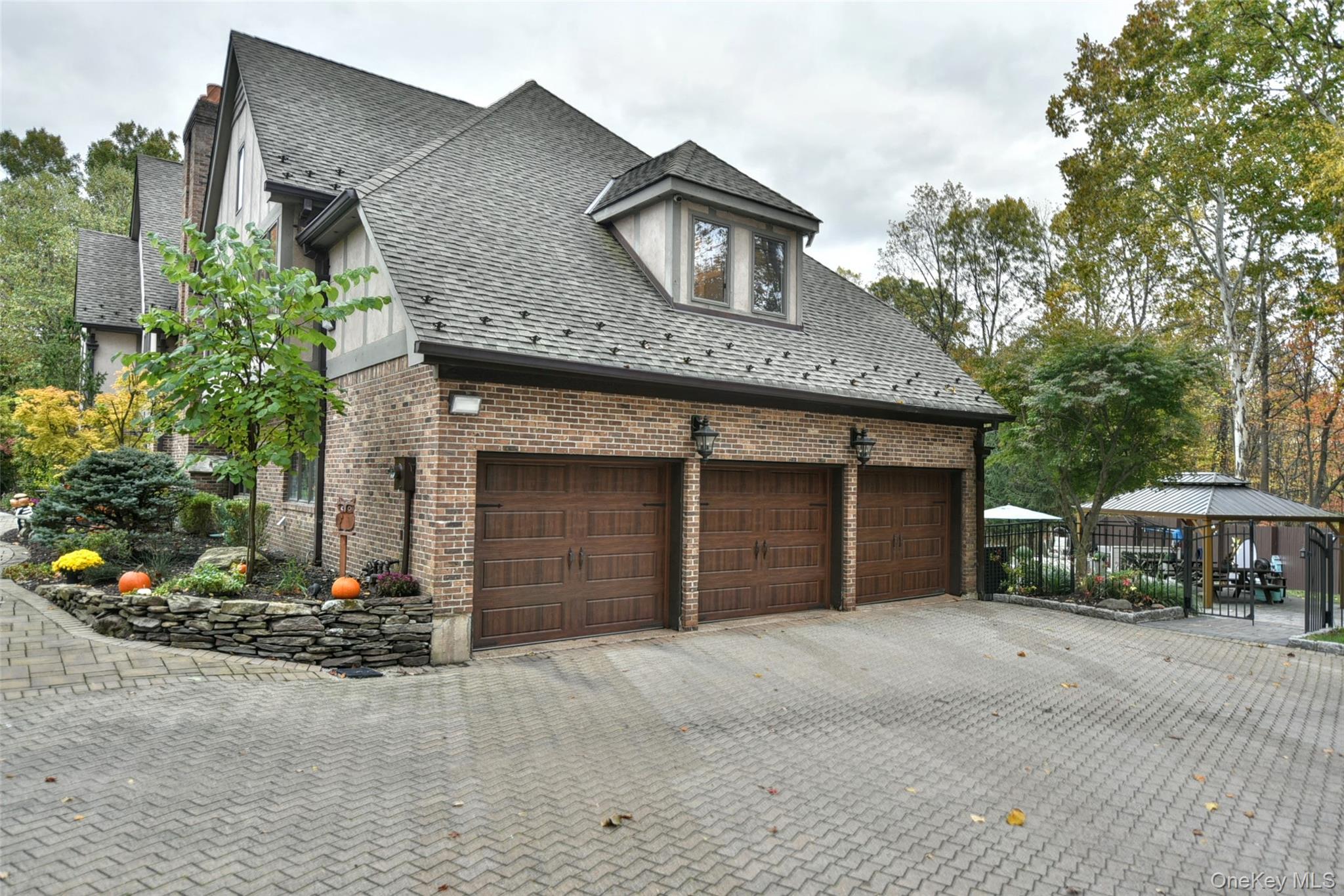 4 Abbey Road West Nyack, NY 10994 - Photo 5 of 50 a front view of a house with a yard and garage