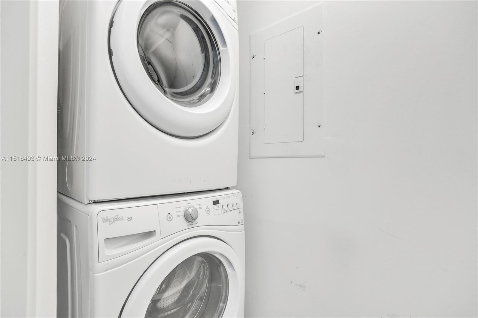 1300 Brickell Bay Drive, Unit 3003 Miami, FL 33131 - Photo 16 of 31 a close up view of a washer and dryer