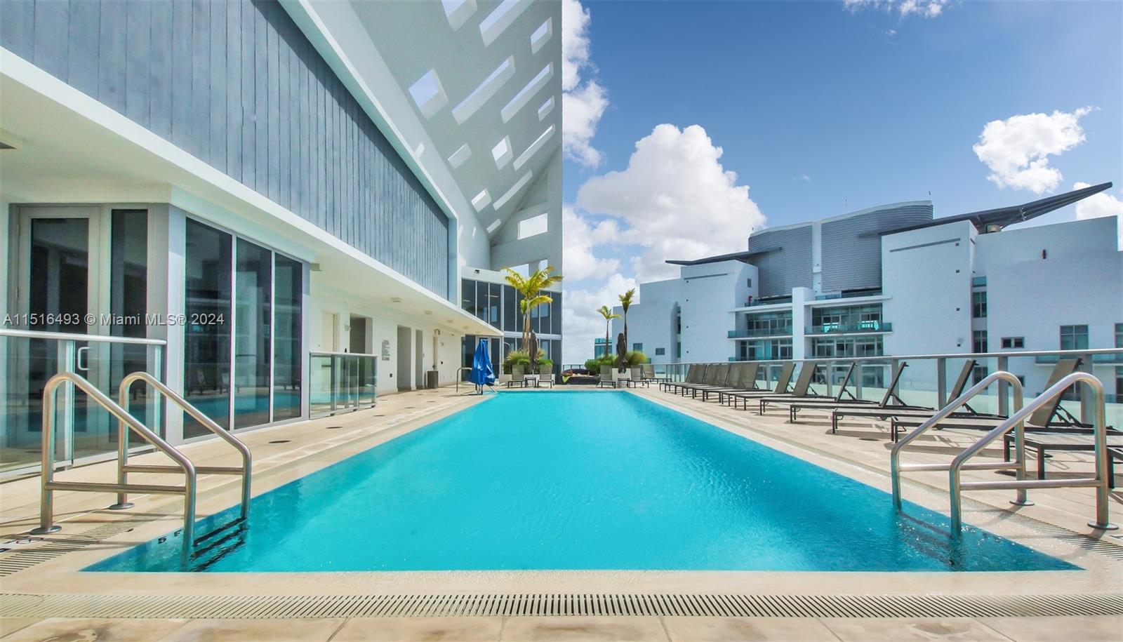 1300 Brickell Bay Drive, Unit 3003 Miami, FL 33131 - Photo 22 of 31 a view of a house with a swimming pool