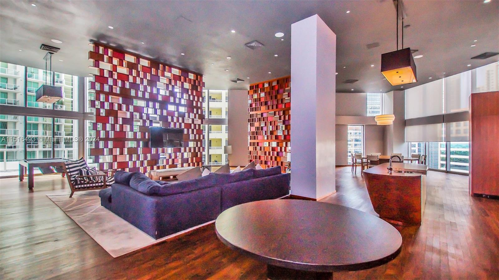 1300 Brickell Bay Drive, Unit 3003 Miami, FL 33131 - Photo 27 of 31 a living room with fireplace furniture and a large window