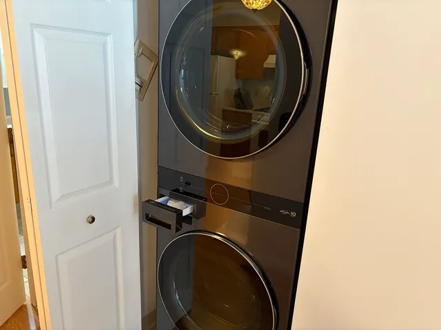 an empty room with wooden floor and window