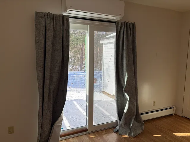 a view of a elevator with wooden floor