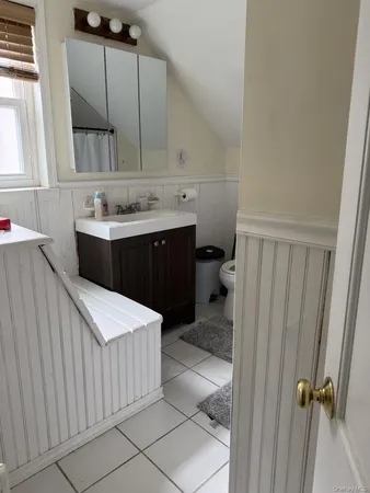 a bathroom with a sink a vanity and mirror