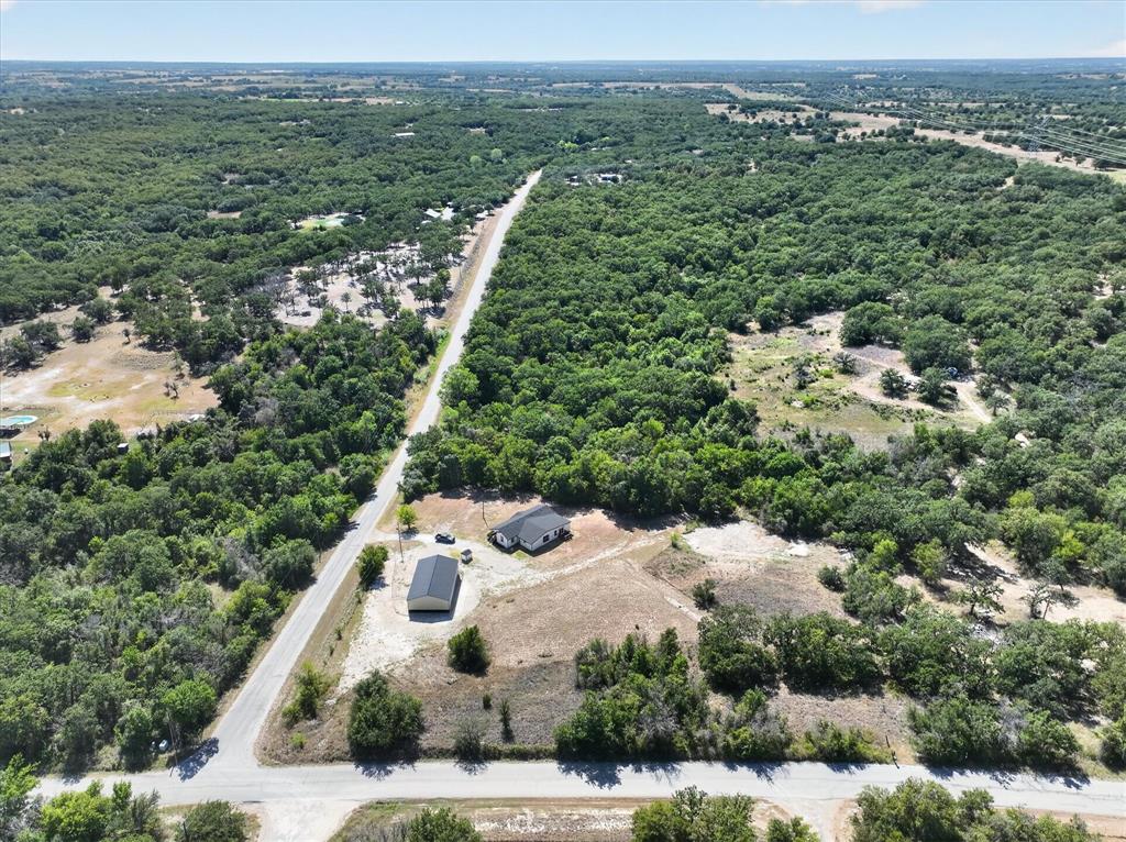 130 R&R Drive Springtown, TX 76082 - Photo 8 of 40 Aerial perspective showcasing the property with a visible structure and an additional outbuilding
